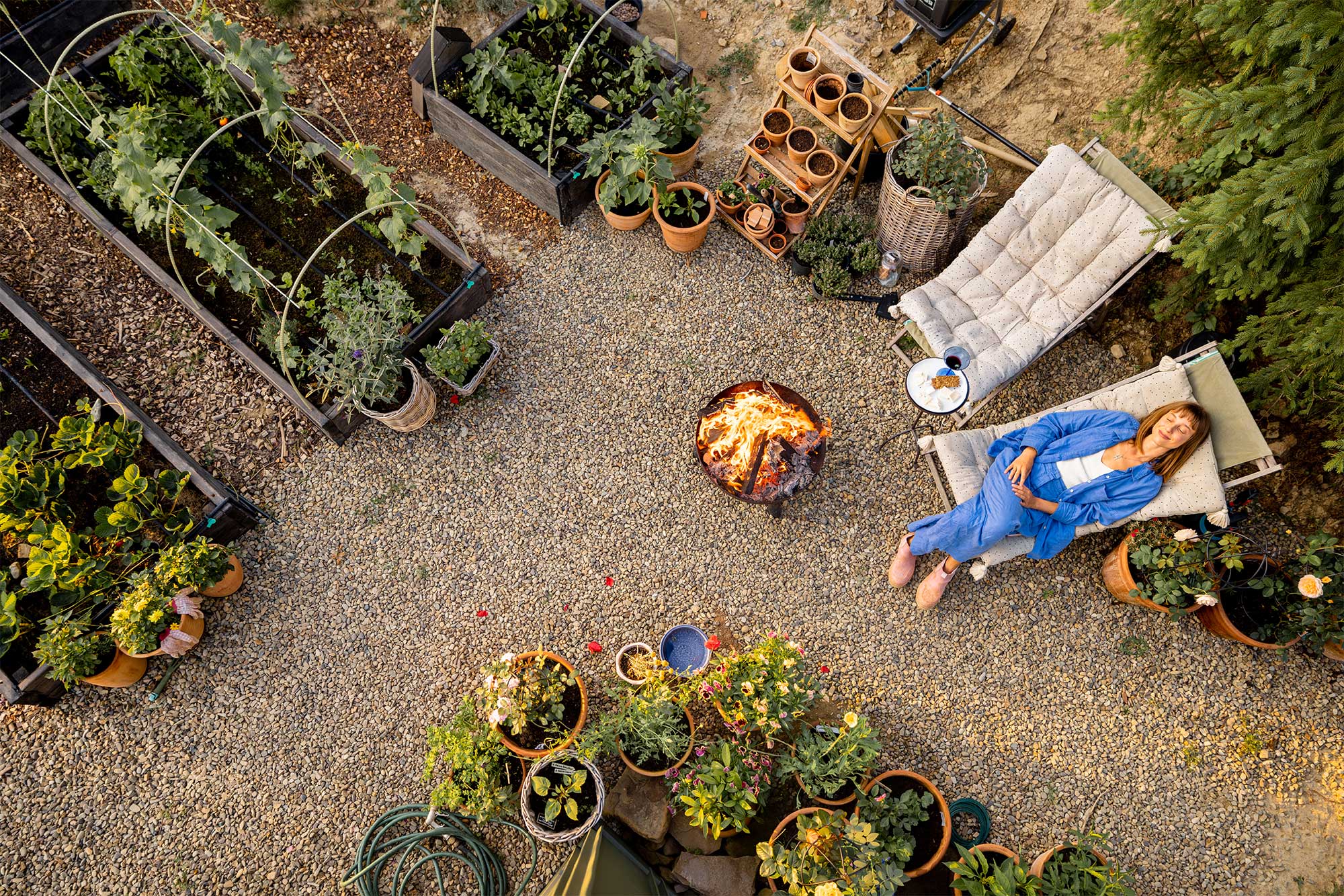 A woman wearing jeans chilling in the garden